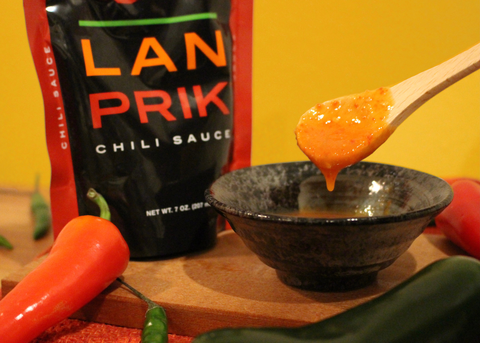 Lan Prik chili sauce dripping from a spoon