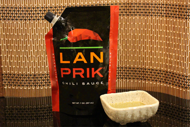 LAN PRIK pouch styled beside a dish